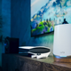 A photo of the Orbi mesh router with a PS5 in the background